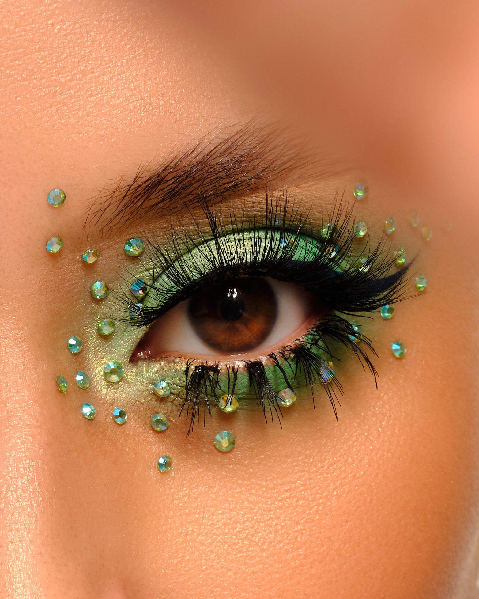 Festival makeup, Rave makeup, Euphoria Makeup, Makeup Artist, Rhinestone Makeup, Makeup Essentials, green blue rhinestones, euphoria inspired makeup